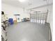 A spacious, well-lit two car garage featuring epoxy floors, ready for parking and storage at 311 Compass Point Dr # 101, Bradenton, FL 34209