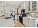 Well-lit kitchen with stainless steel appliances and a tiled backsplash at 311 Compass Point Dr # 101, Bradenton, FL 34209