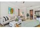 Cozy living room with shiplap accent wall, comfortable seating, and natural light at 311 Compass Point Dr # 101, Bradenton, FL 34209