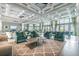 Elegant lounge area featuring plush seating, a stylish coffee table, and an abundance of natural light at 311 Compass Point Dr # 101, Bradenton, FL 34209