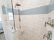 Walk in shower with glass partition, dual shower heads, and tiled walls at 311 Compass Point Dr # 101, Bradenton, FL 34209