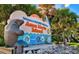 Anna Maria Island welcome sign with a manatee figure and vibrant colors, showcasing local attractions near Holmes Beach at 311 Compass Point Dr # 101, Bradenton, FL 34209