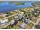 A scenic aerial view highlighting canal-front homes in a charming waterfront neighborhood, complete with boat docks and serene waterways at 3239 Daytona Dr, Punta Gorda, FL 33983