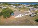 Aerial view capturing a screened lanai next to open space, and highlights the home's neighborhood location at 3239 Daytona Dr, Punta Gorda, FL 33983