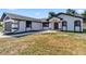 Charming single Gathering home featuring updated paint, manicured lawn, and attached two-car garage at 3239 Daytona Dr, Punta Gorda, FL 33983