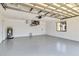 Spacious garage with a sealed floor, modern window, water heater and an insulated garage door at 3239 Daytona Dr, Punta Gorda, FL 33983