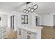 Kitchen island featuring sleek cabinetry and quartz countertops at 3239 Daytona Dr, Punta Gorda, FL 33983