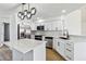 Bright kitchen featuring stainless appliances, tile backsplash and quartz countertops at 3239 Daytona Dr, Punta Gorda, FL 33983