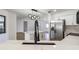 Bright and airy kitchen with quartz countertops, stainless steel appliances, island, and a modern black faucet at 3239 Daytona Dr, Punta Gorda, FL 33983