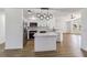 Modern kitchen features white cabinets, stainless steel appliances, and a center island at 3239 Daytona Dr, Punta Gorda, FL 33983