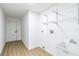 Well lit laundry room with wash basin and shelving at 3239 Daytona Dr, Punta Gorda, FL 33983