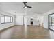 Open floor plan with light colored floors, dining room, view of the kitchen and lots of natural light at 3239 Daytona Dr, Punta Gorda, FL 33983