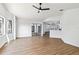 Bright living room featuring wood flooring, windows, and sliding glass doors at 3239 Daytona Dr, Punta Gorda, FL 33983