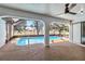 Covered pool area with screened enclosure, tan flooring, and view of the backyard at 3239 Daytona Dr, Punta Gorda, FL 33983