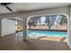 Covered pool area with screened enclosure, tan flooring, and view of the backyard at 3239 Daytona Dr, Punta Gorda, FL 33983