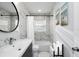 Stylish bathroom featuring marble-patterned tile, modern fixtures, and a soaking tub at 3303 32Nd W St, Bradenton, FL 34205