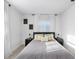 Up-close, well-lit, queen-sized bedroom features a cozy atmosphere with lamps, bedside tables, and soft pillows at 3303 32Nd W St, Bradenton, FL 34205