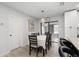 Bright dining room features a stylish table with seating for six and modern light fixture at 3303 32Nd W St, Bradenton, FL 34205