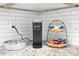 Close-up of a kitchen corner with a Keurig coffee maker and charming snack basket at 3303 32Nd W St, Bradenton, FL 34205