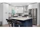 Modern kitchen featuring island with seating, stainless steel appliances, and granite countertops at 3303 32Nd W St, Bradenton, FL 34205