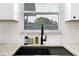 Modern kitchen sink with granite countertops, stylish faucet, and window view at 3303 32Nd W St, Bradenton, FL 34205