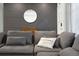 Inviting living room features a cozy sectional sofa with decorative pillows and an accent wall at 3303 32Nd W St, Bradenton, FL 34205