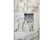 Close-up of the stylish shower niche featuring decorative tiles and adding a touch of elegance at 3303 32Nd W St, Bradenton, FL 34205
