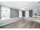 Bright and airy sunroom featuring light gray walls, large windows and plank floors at 3303 32Nd W St, Bradenton, FL 34205