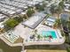 Aerial view of community amenities, including a pool, putting green, parking and other recreational areas at 3352 Laurel Oak Way, Sarasota, FL 34237