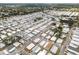 An aerial view of a large neighborhood with tidy homes and manicured streets surrounded by trees at 3352 Laurel Oak Way, Sarasota, FL 34237