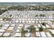 Aerial view of a well maintained neighborhood with tree lined streets and uniform homes at 3352 Laurel Oak Way, Sarasota, FL 34237
