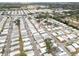 Aerial view of a community with many homes and tree lined streets and a red pushpin over a house at 3352 Laurel Oak Way, Sarasota, FL 34237