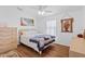 Cozy bedroom with laminate flooring, ceiling fan, and tranquil decor at 3352 Laurel Oak Way, Sarasota, FL 34237