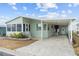 Charming single-story home with a covered carport and well-maintained landscaping, offering curb appeal at 3352 Laurel Oak Way, Sarasota, FL 34237