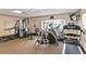 Community fitness center featuring multiple machines, free weights, and a wall-mounted television at 3352 Laurel Oak Way, Sarasota, FL 34237