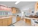 Bright kitchen features ample cabinet space, tile flooring, and a cozy breakfast nook perfect for morning coffee at 3352 Laurel Oak Way, Sarasota, FL 34237