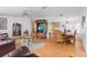 Bright and open living space with wood flooring, blending into the dining area and kitchen at 3352 Laurel Oak Way, Sarasota, FL 34237
