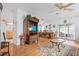 Cozy living room with a television and a view into the dining area at 3352 Laurel Oak Way, Sarasota, FL 34237