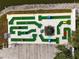 Aerial view of the community's miniature golf course, set against a backdrop of a body of water at 3352 Laurel Oak Way, Sarasota, FL 34237