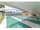 View of the community's covered shuffleboard courts, ideal for recreational activities and friendly competition at 3352 Laurel Oak Way, Sarasota, FL 34237