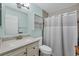 Cozy bathroom featuring a shower with a white shower curtain and neutral paint at 3500 Green View Ct # 45, Sarasota, FL 34231