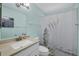 Serene bathroom features granite countertops and a zen shower curtain at 3500 Green View Ct # 45, Sarasota, FL 34231