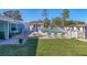Community pool area with lounge chairs and shade umbrellas for relaxing at 3500 Green View Ct # 45, Sarasota, FL 34231