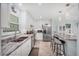 Spacious kitchen showcasing granite countertops, stainless steel appliances, and a convenient breakfast bar area at 3500 Green View Ct # 45, Sarasota, FL 34231