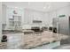 Modern kitchen with stainless steel appliances, marbled counter tops, and bright white cabinets at 3500 Green View Ct # 45, Sarasota, FL 34231