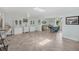 Bright living room with gray tiling, skylight, ceiling fans, and neutral paint at 3500 Green View Ct # 45, Sarasota, FL 34231
