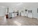 View of the living room showing its open layout and breakfast bar connecting to the kitchen at 3500 Green View Ct # 45, Sarasota, FL 34231