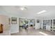 Open floor plan shows living room with plush furniture, tile floors, and natural light at 3500 Green View Ct # 45, Sarasota, FL 34231