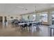 Bright community meeting room with tables and chairs, overlooking the pool at 3500 Green View Ct # 45, Sarasota, FL 34231