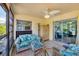 Cozy screened-in porch featuring comfortable furniture, offering a relaxing space to enjoy the outdoors at 3500 Green View Ct # 45, Sarasota, FL 34231